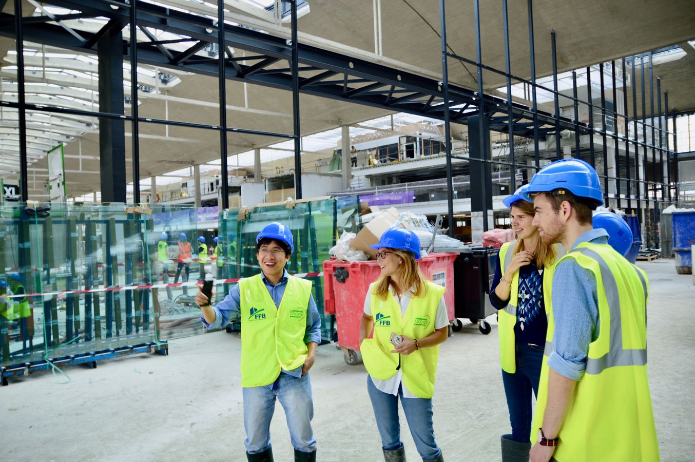 Construction delivery team coordinating inside an active building site
